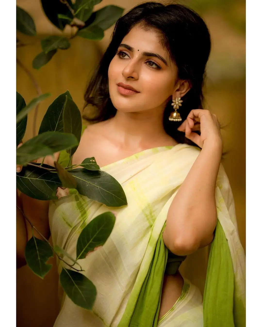 Indian Actress Iswarya Menon In Traditional Green Saree Sleeveless Blouse